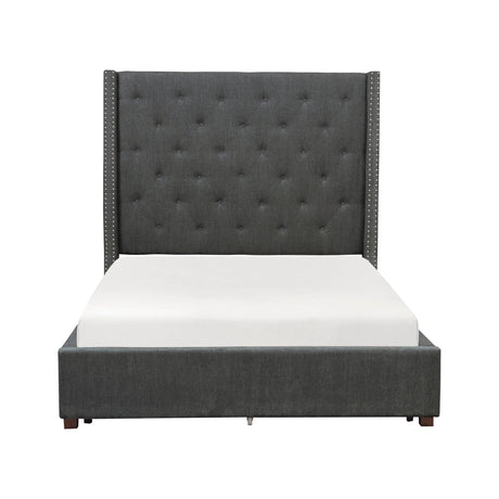 King bed side angle showing fabric upholstery and nailhead trim