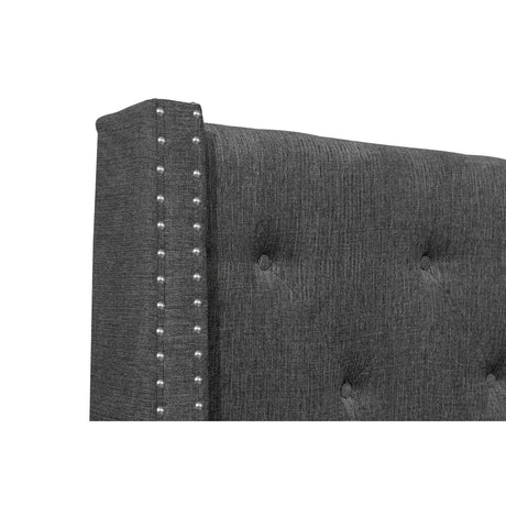 Detail of nailhead trim on upholstered headboard