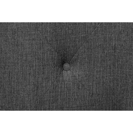 Button-tuft and nailhead accents on headboard
