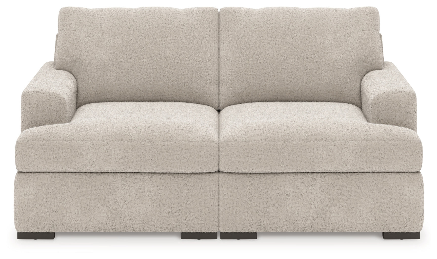 Detail view of plush upholstery on sectional sofa