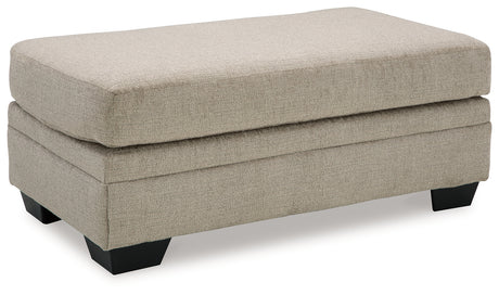 Side angle of loveseat in Stonemeade taupe set