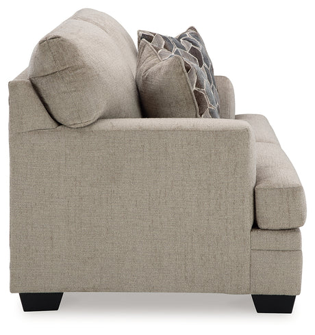 Back angle of loveseat in taupe finish