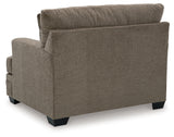 side profile of Stonemeade Nutmeg loveseat and ottoman