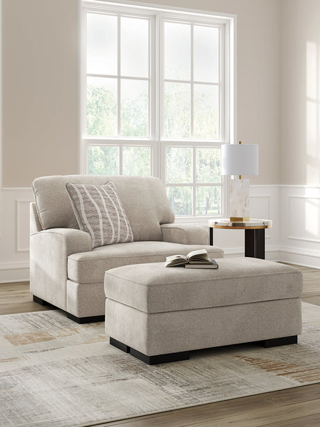 Taupe Profile Chair angled view with ottoman