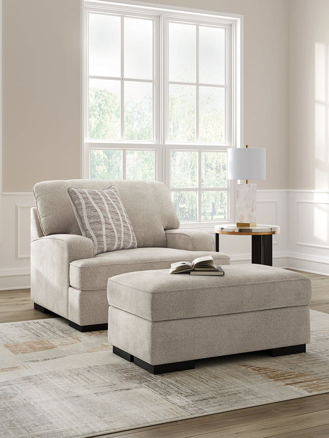 Taupe Profile Chair angled view with ottoman