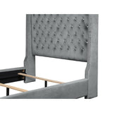 Jacklyn Gray gray tufted faux leather king panel bed - angled corner