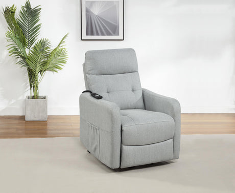 Close-up of recliner arm with light grey upholstery