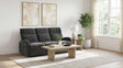 Side angle showing plush pillow arm and footrest extended
