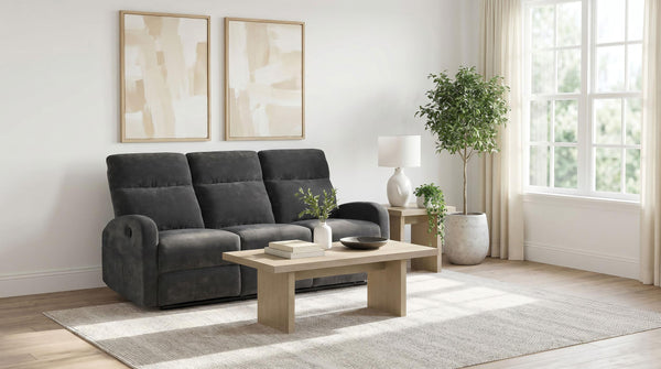Side angle showing plush pillow arm and footrest extended