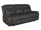 Lawrence tufted reclining loveseat in dark grey, angled side view