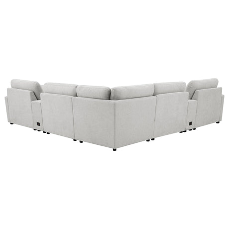 Close-up of grey fabric and power reclining control on Collins sectional