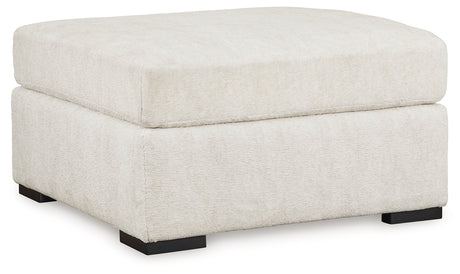 Living room view of Chessington Ivory 2-Piece Sectional Sofa with Ottoman