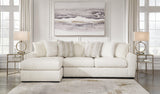 Close-up detail of Chessington Ivory 2-Piece Sectional Sofa fabric and chaise