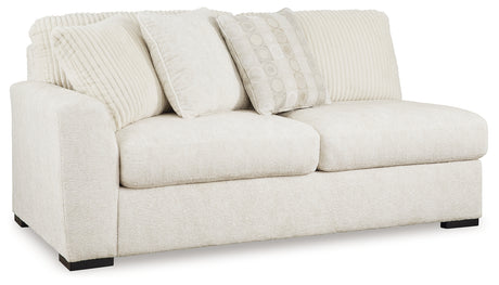 Side view of Chessington Ivory 2-Piece Sectional Sofa with Ottoman