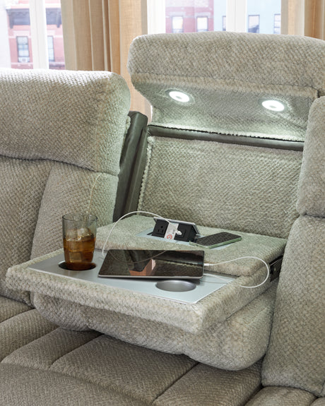 Built-in storage arm with USB port and cup holder
