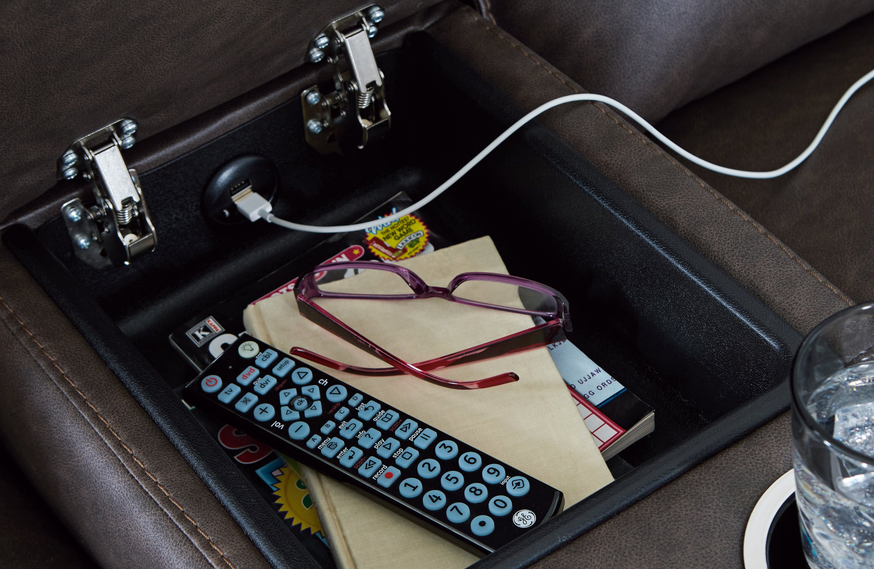 Close-up of padded center console with dual cup holders