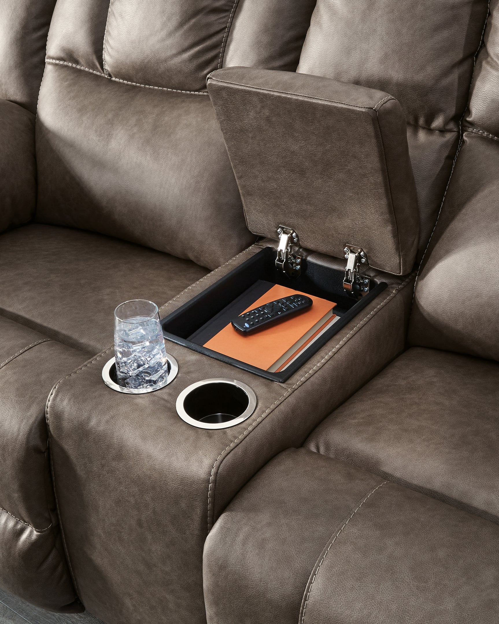 Center console detail with cup holders and storage