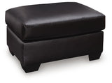 Glennbre Midnight Faux Leather Ottoman angled view