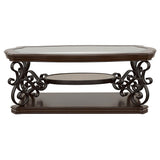 Scrollwork detail on metal legs of Laney table set