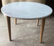 Aldis round coffee table viewed from the side showing white marble top and mango wood base