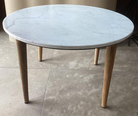 Aldis round coffee table viewed from the side showing white marble top and mango wood base