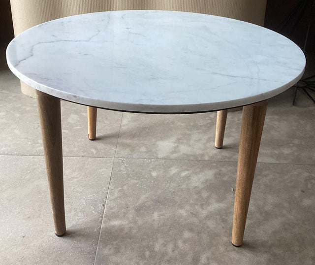 Aldis round coffee table viewed from the side showing white marble top and mango wood base