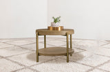 Side view of Arini Round End Side Table showcasing woven rattan shelf and metal legs