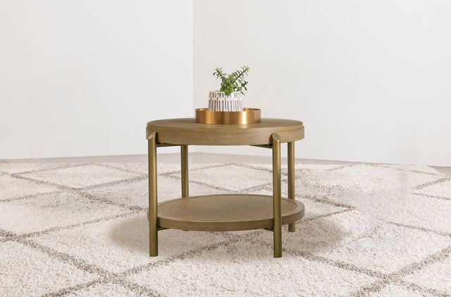 Side view of Arini Round End Side Table showcasing woven rattan shelf and metal legs