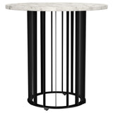 Side view of the round marble end table with black iron base