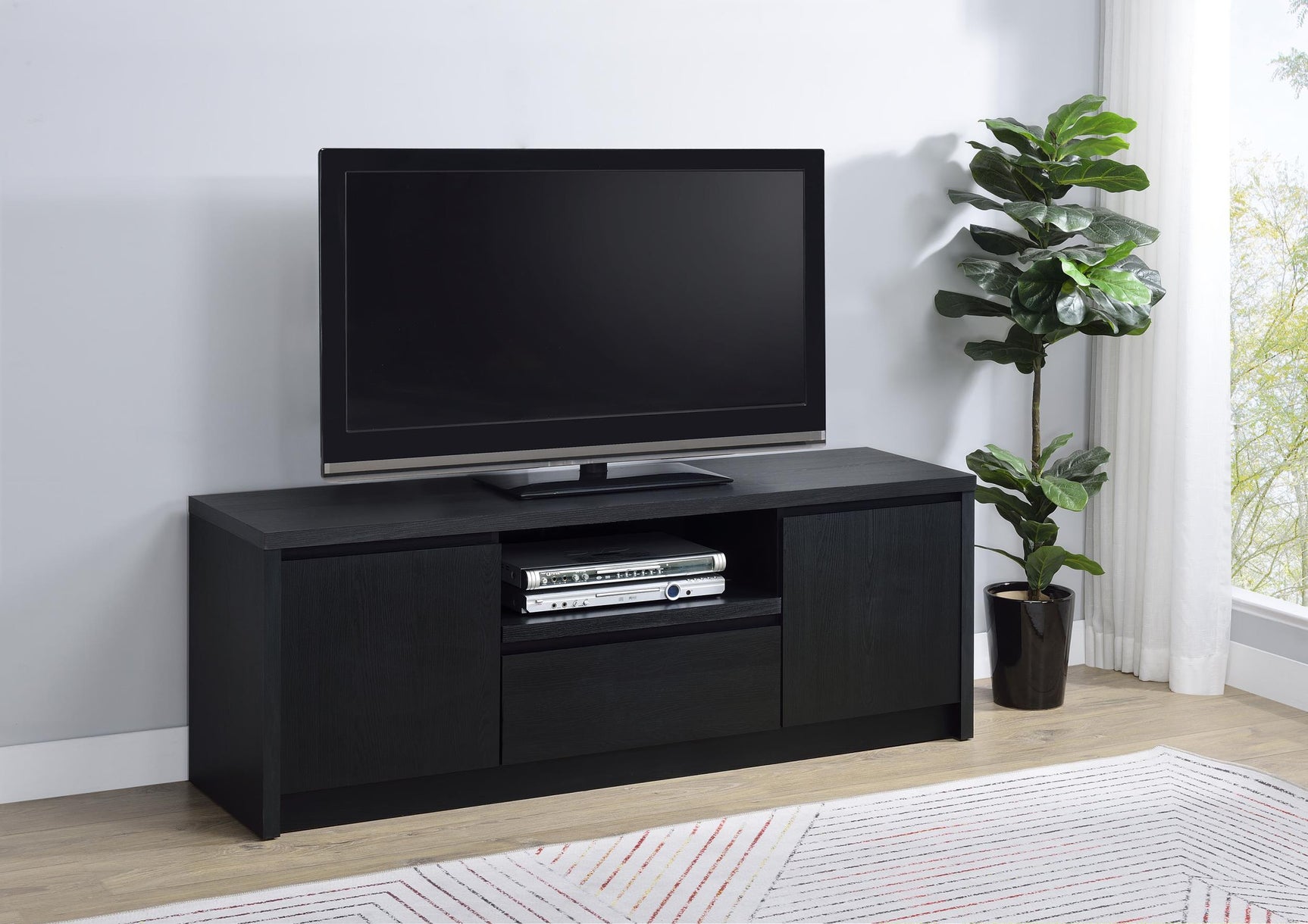 Side angle of Winfield black TV stand showing storage doors