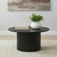 Side angle of Hamlyn round fluted black coffee table