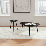 Odessa black mango wood end table in bright room