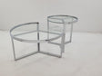 Delia 2-piece round glass top nesting coffee tables, side view with chrome frames