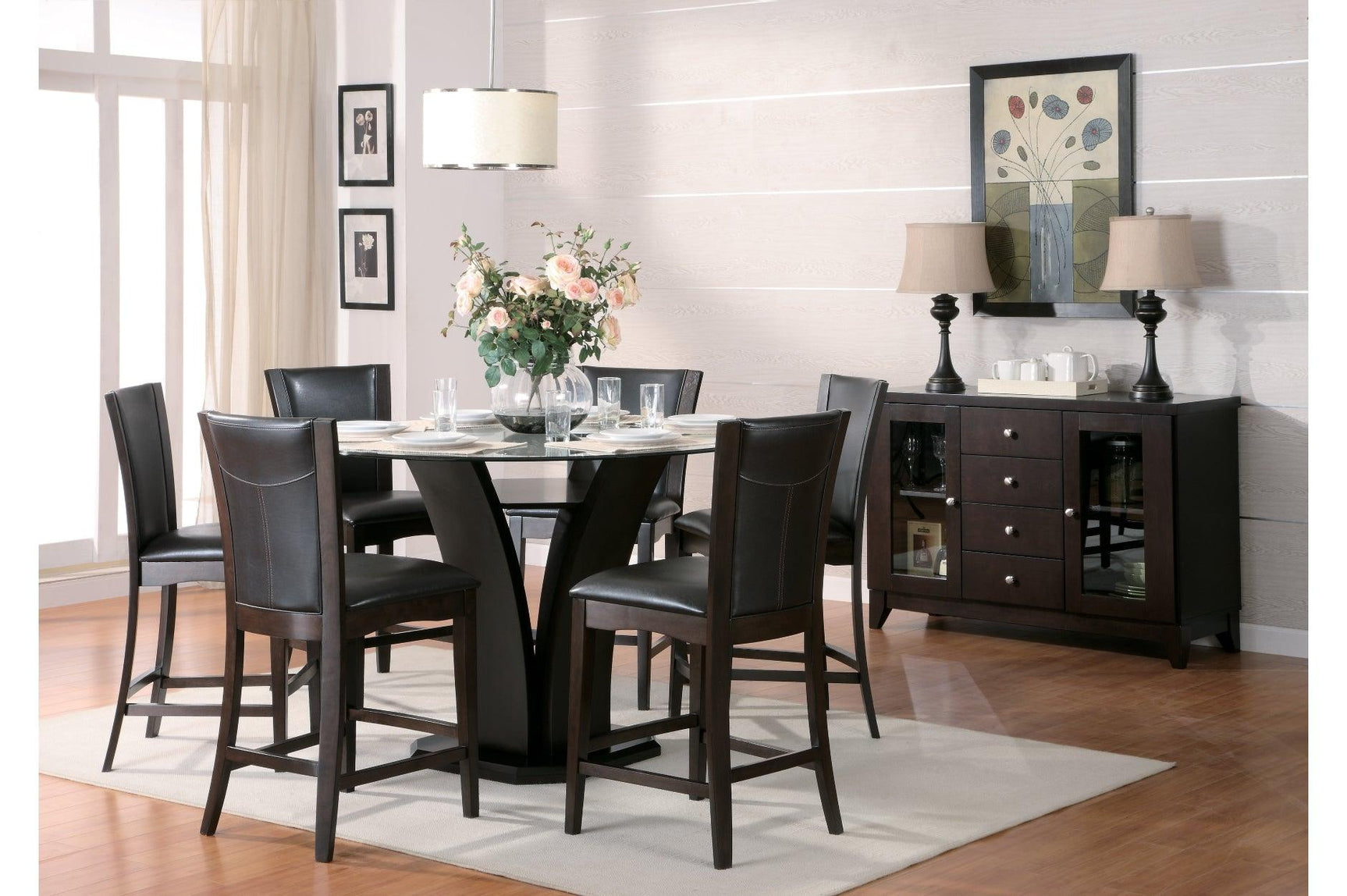Side view of Daisy dining set showing round glass top and faux leather upholstered chairs
