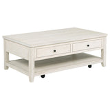 Wide lower shelf of Payne coffee table with baskets