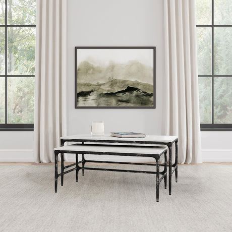Ebby nesting coffee tables side angle showing marble surface and black iron frame