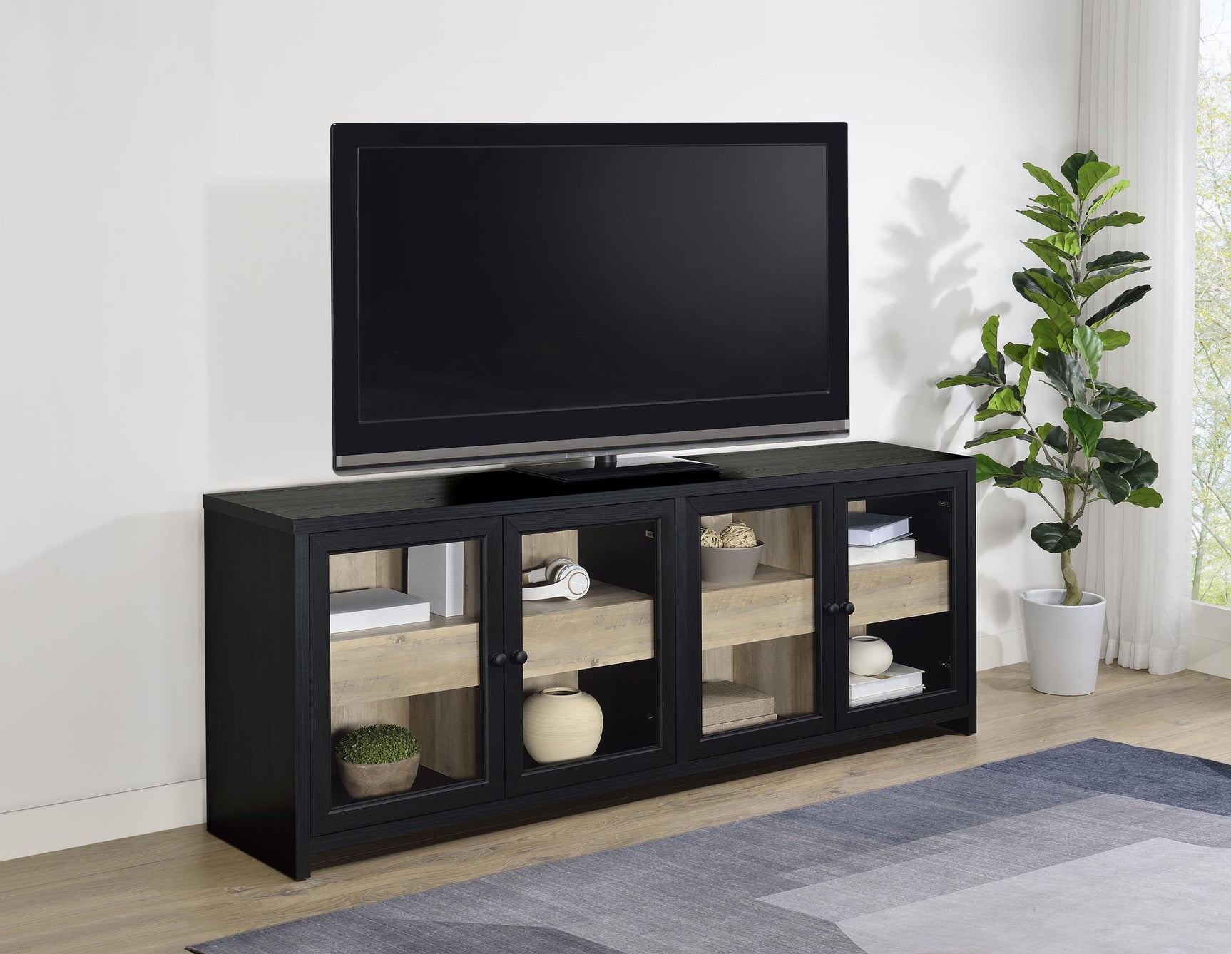 Denison media console close-up of glass door and drawer interior