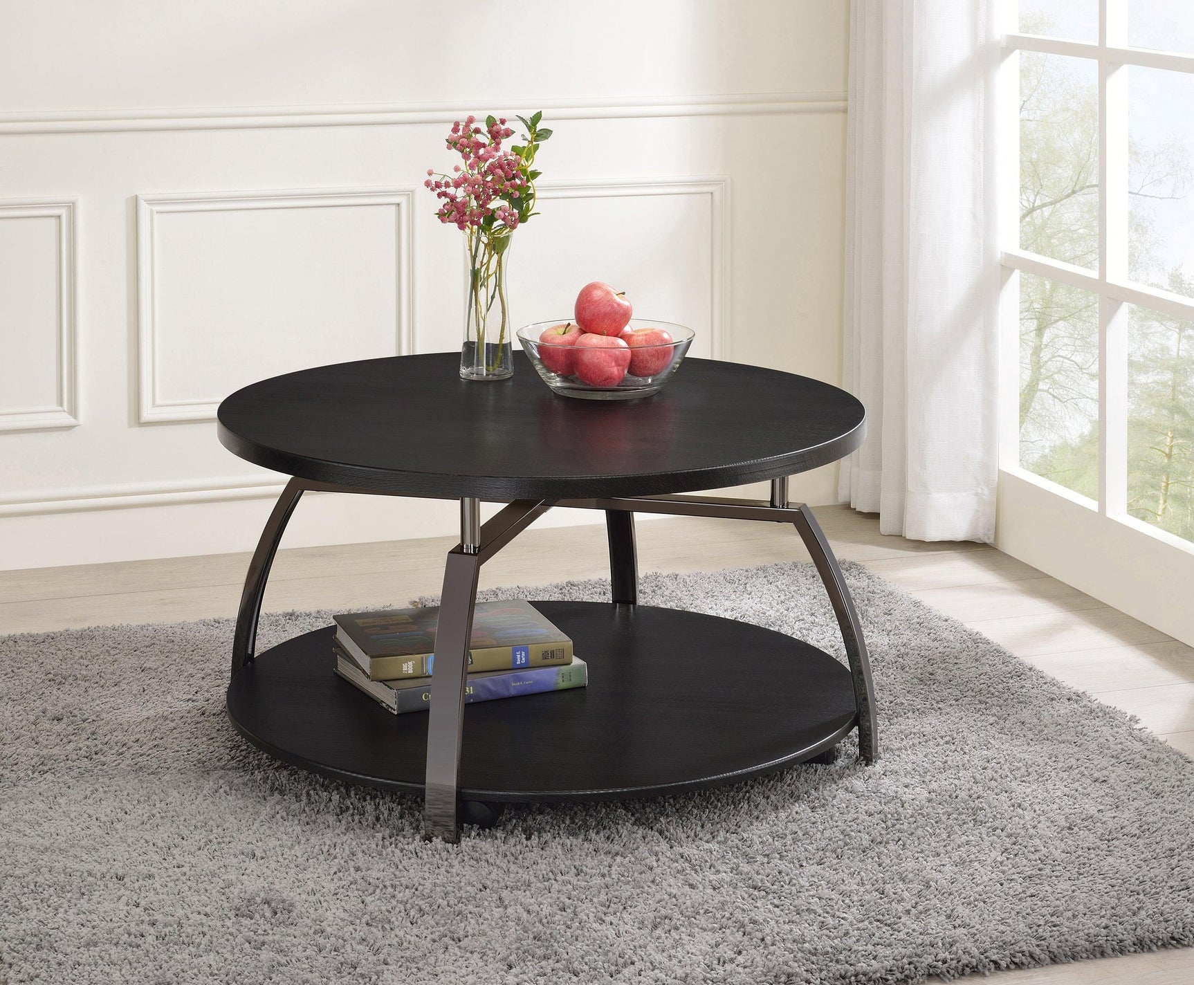Dacre Round Coffee Table with bottom shelf, angled metal base, side angle