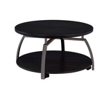 Detail of black nickel metal legs and dark grey round tabletop