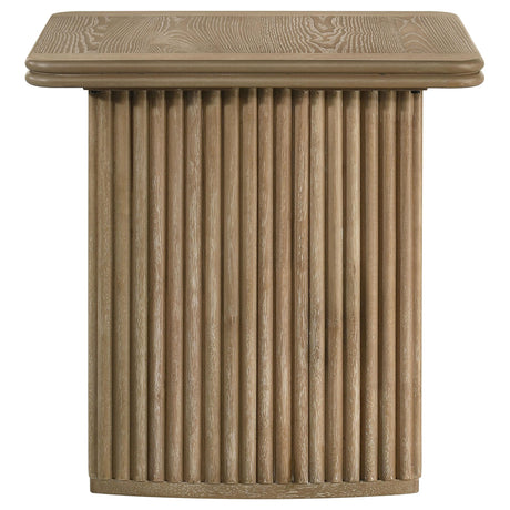 Side view of coffee table showing rounded corners and pedestal base