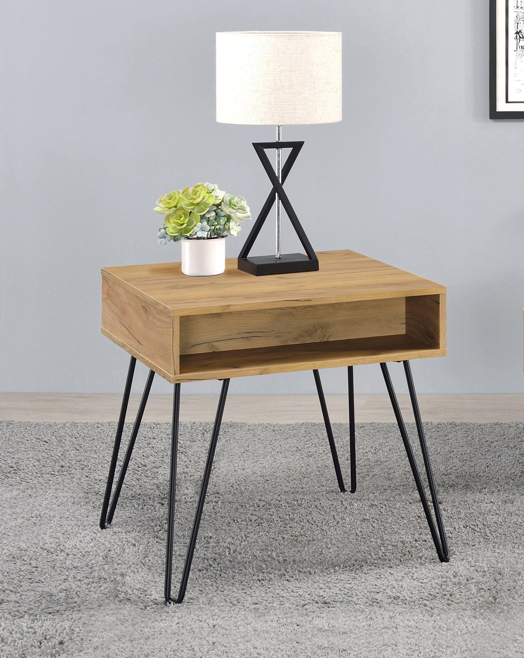 Close-up of golden oak tabletop and black metal framework
