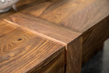 Skeet coffee table with natural finish in bright living room space
