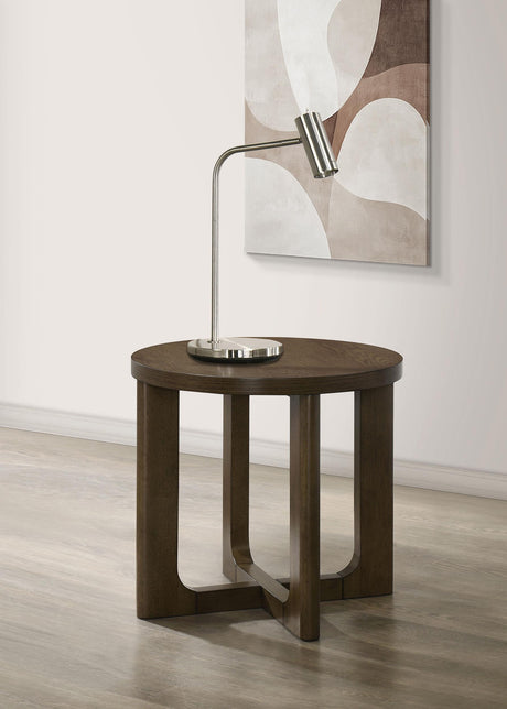 Side view of Kessler Round Sculptural Wood End Table brown finish