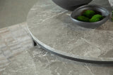 Close-up of gunmetal metal frame and faux marble tabletop