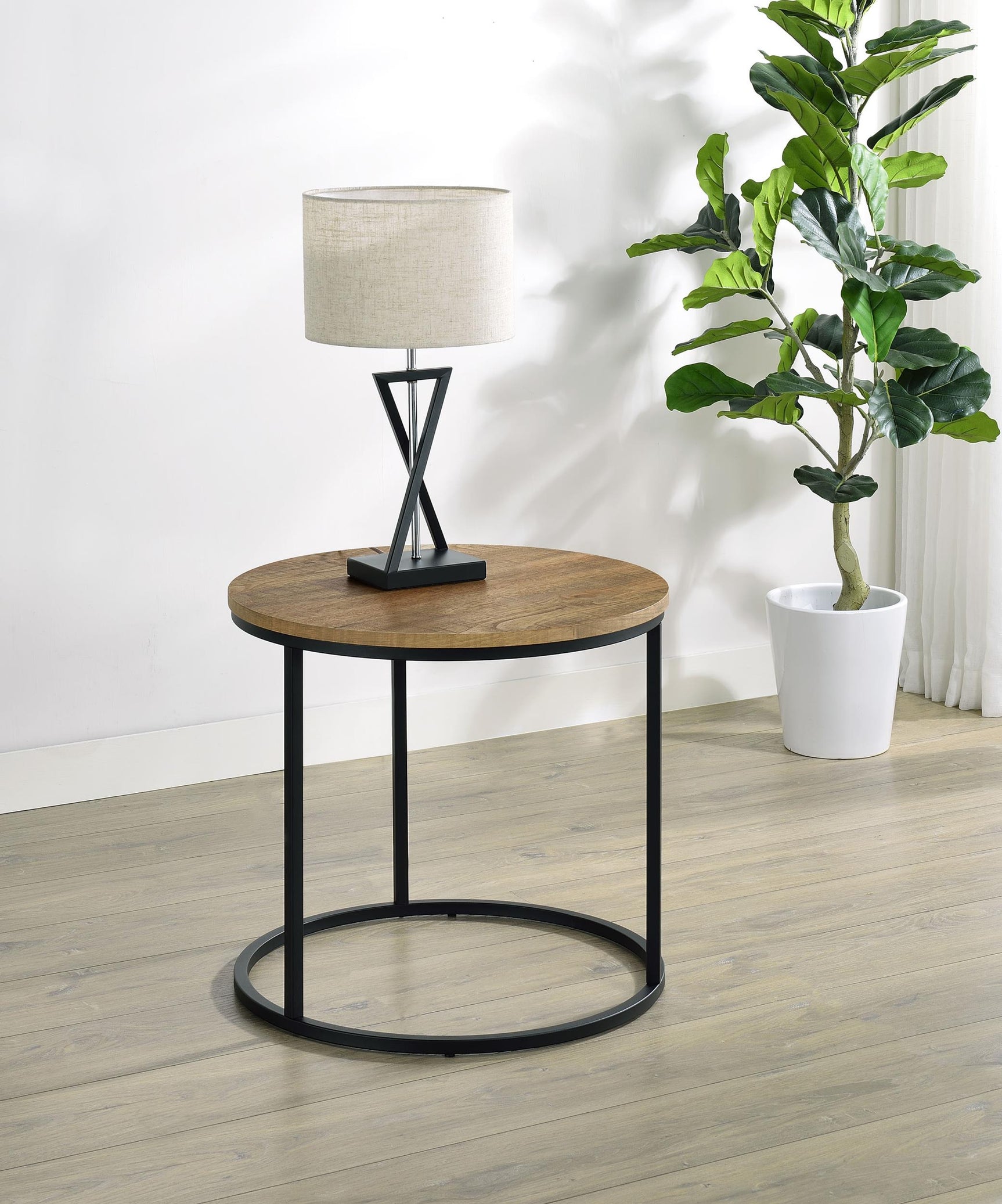 Side angle of Lainey round occasional side table with metal base