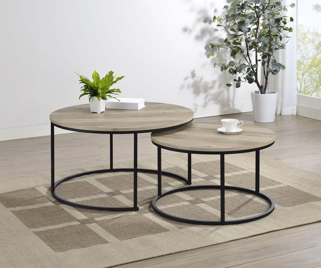 Small round nesting coffee table with metal base and distressed pine top