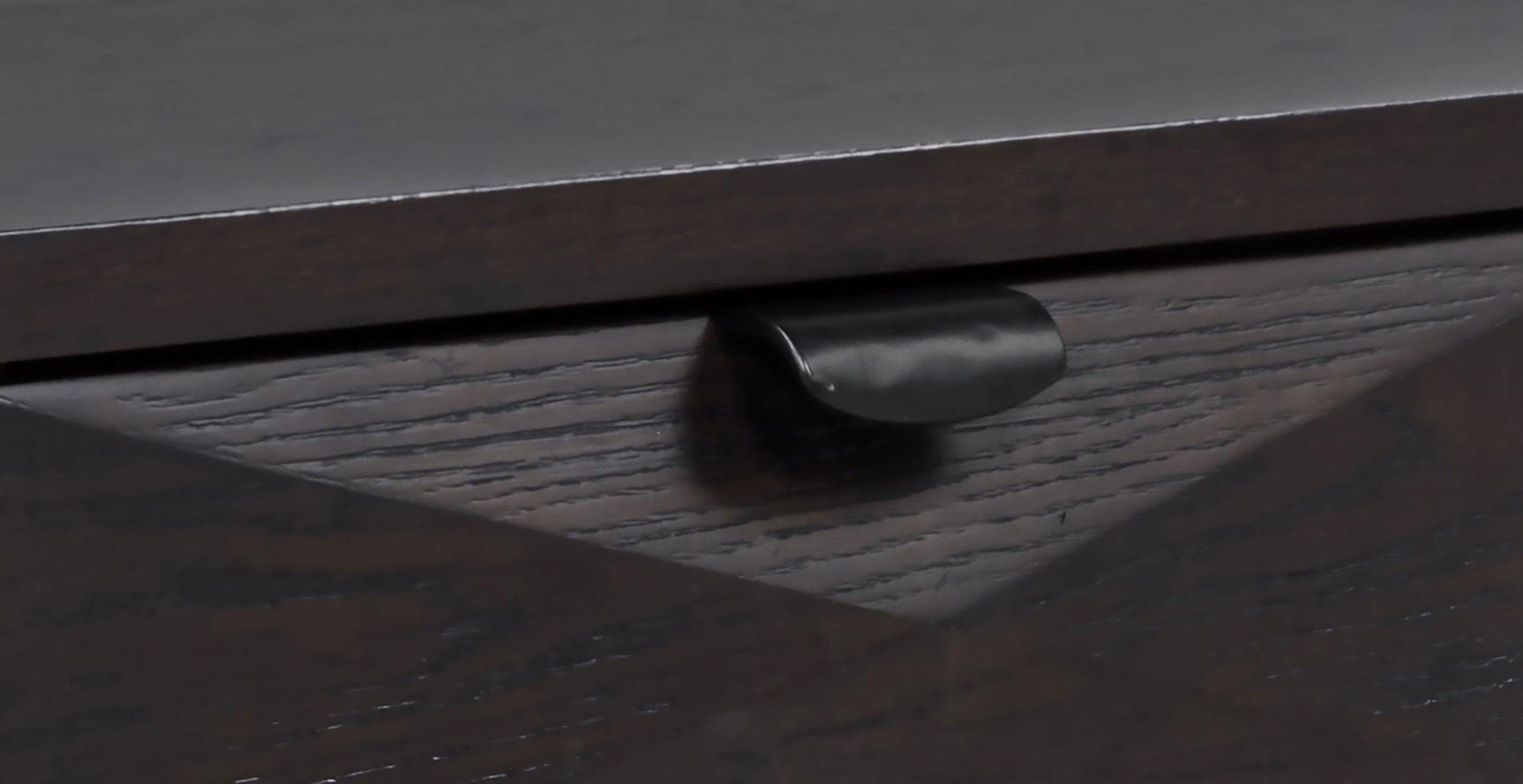 Close-up of drawer detail with tinted fronts and wood grain