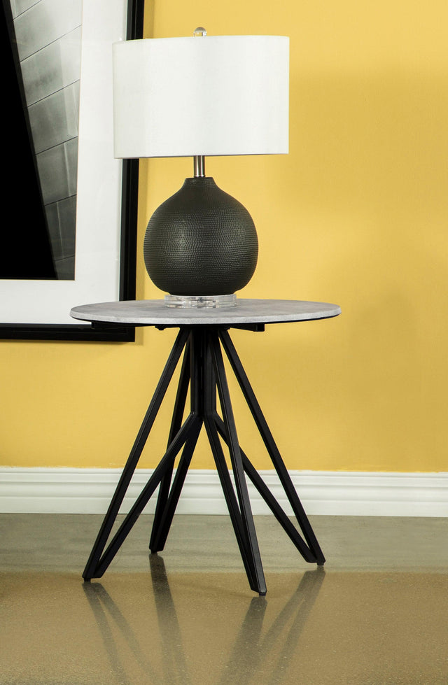 Side view of Hadi round end table showing hairpin legs and cement tabletop