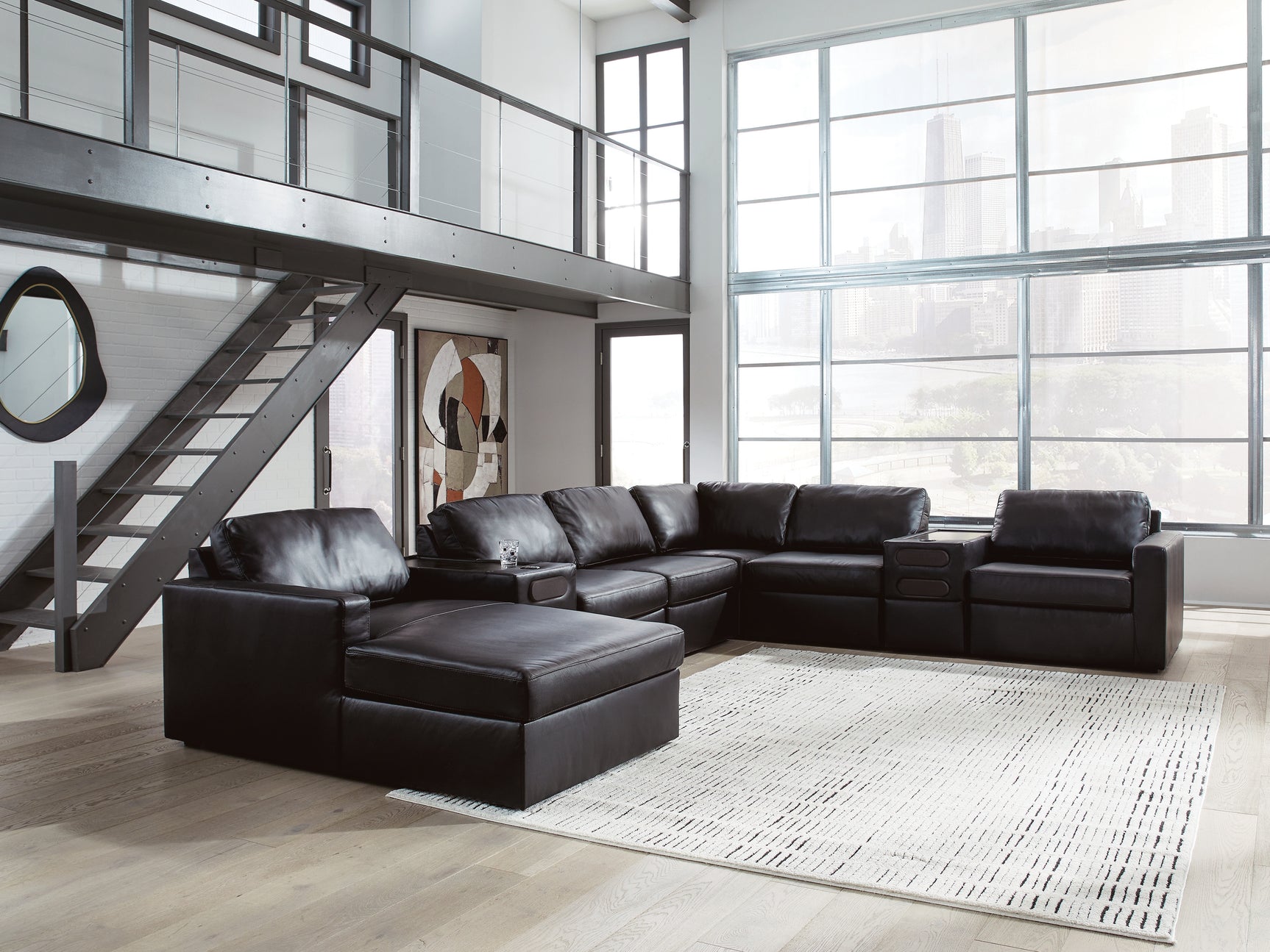 Room view of Modmax II black leather sectional with chaise