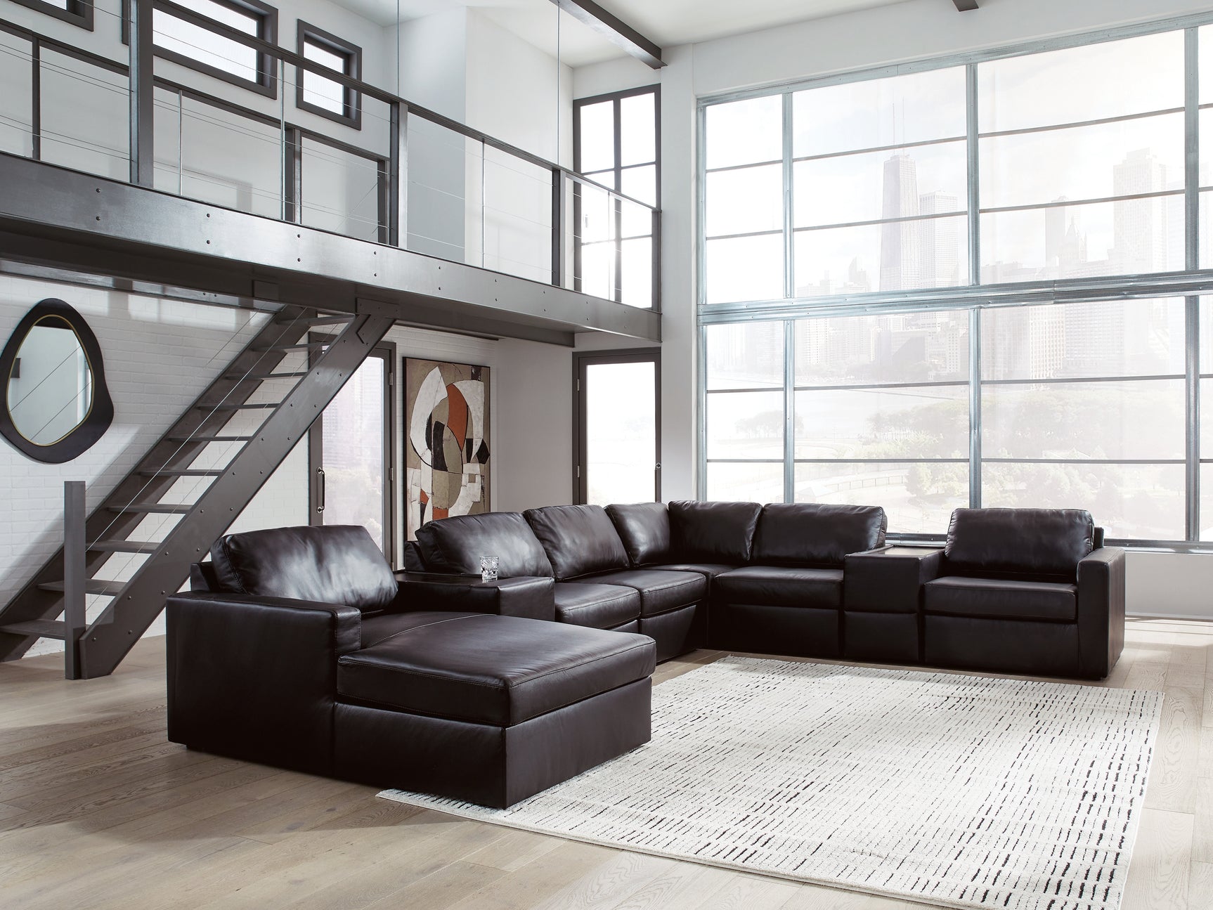 Side angle of Modmax II black leather sectional sofa with chaise